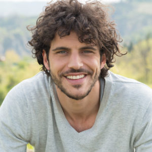 Portrait Of Smiling Young Man Outside