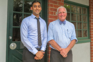 dr pate and dr cox in front of door